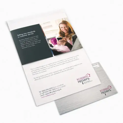 Self-contained mailer describing the new service. Image shows one partially opened mailer and one unopened mailer. Outer cover has a brushed steel appearance.